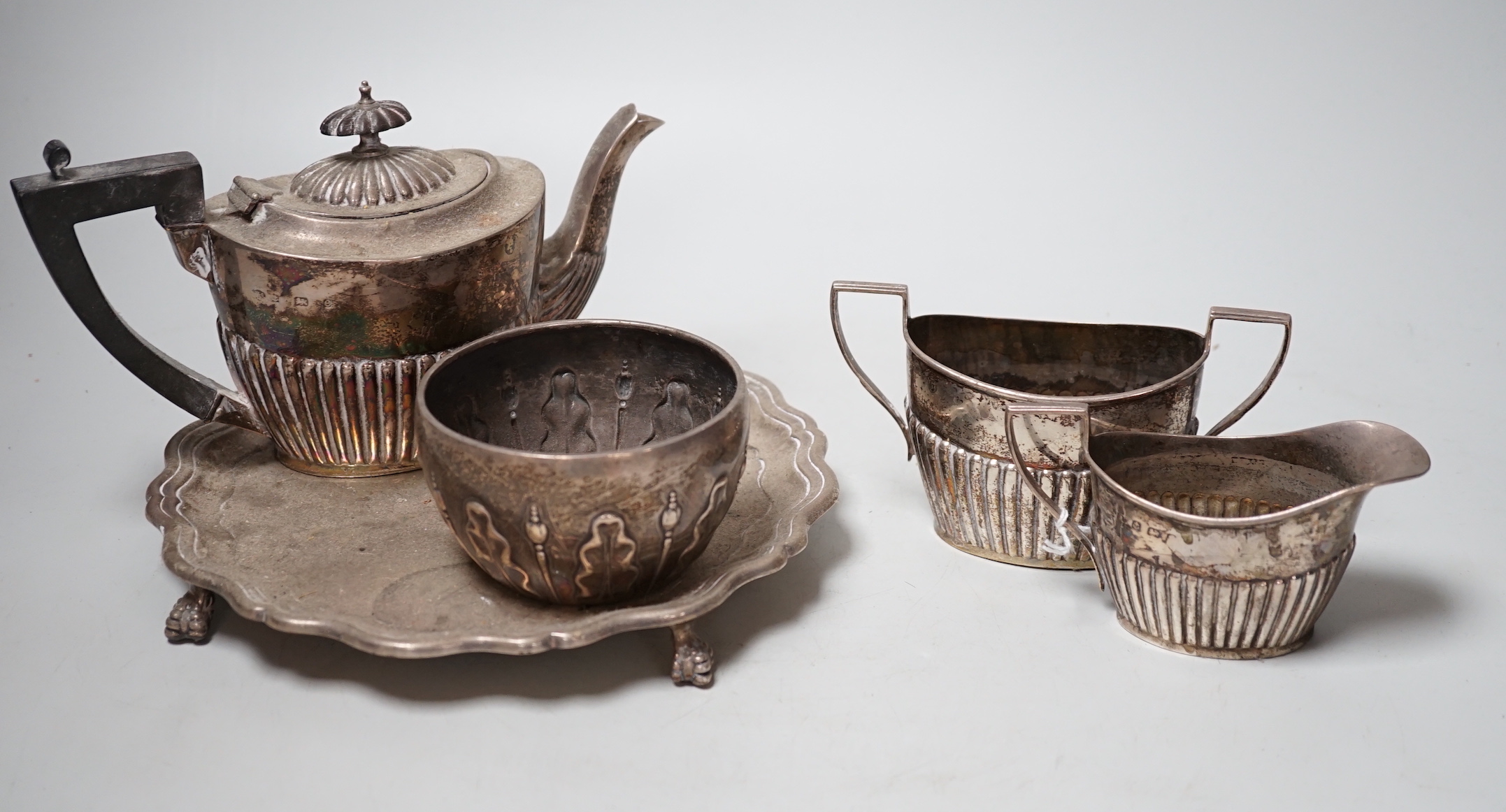 A late Victorian silver sugar bowl, William & John Barnard, London, 1891, a silver three piece bachelor’s tea set and a silver waiter, 27.9oz.